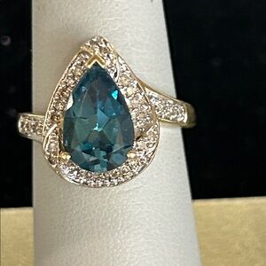 446585 10k yg Elegant Teardrop Blue Topaz and diamond Ring